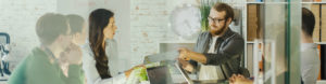Office staff working together to depict commercial insurance by Find Insurance NI