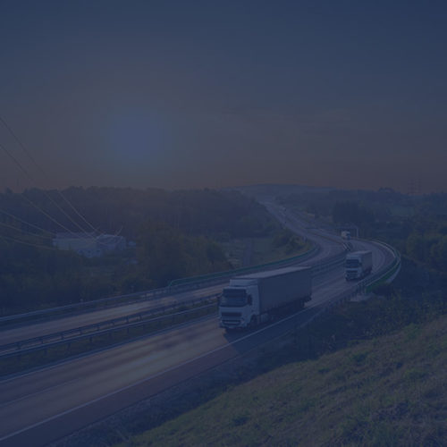Lorries driving down a dual carriageway to depict commercial vehicle insurance by Find Insurance NI