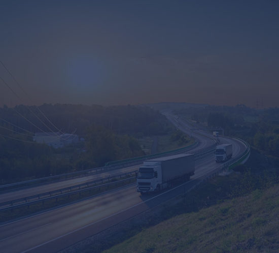 Lorries driving down a dual carriageway to depict commercial vehicle insurance by Find Insurance NI