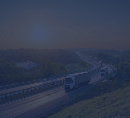 Lorries driving down a dual carriageway to depict commercial vehicle insurance by Find Insurance NI