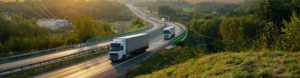 Lorries driving down dual carriageway to depict commercial vehicle insurance by Find Insurance NI
