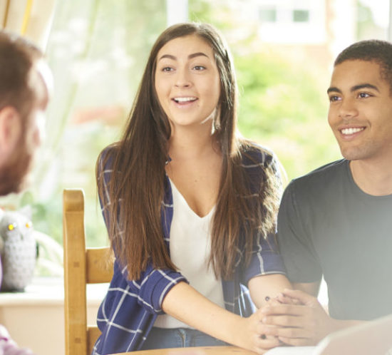 Couple looking delighted with landlord to depict landlord insurance by Find Insurance NI