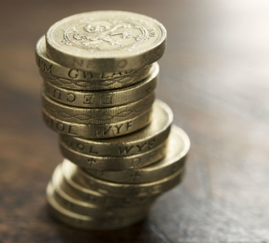 Pound coins in pile for Find Insurance NI blog