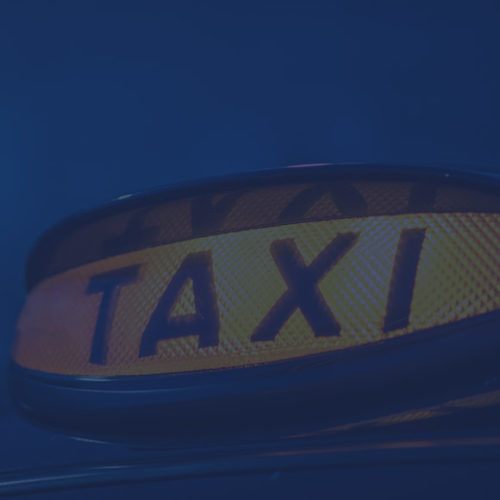 Lit up taxi light to depict taxi insurance by Find Insurance NI