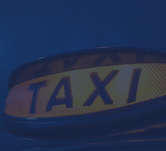 Lit up taxi light to depict taxi insurance by Find Insurance NI