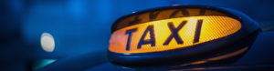Lit up taxi sign to depict Taxi insurance by Find Insurance NI