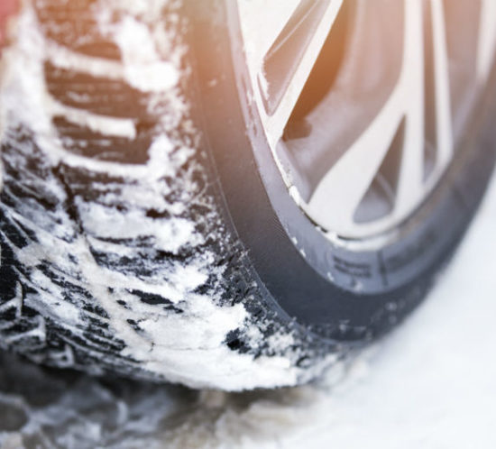Winter tyres covered in snow for Find Insurance NI blog
