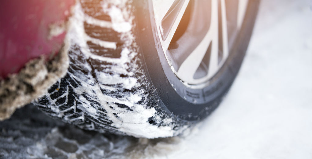 Winter tyres covered in snow for Find Insurance NI blog